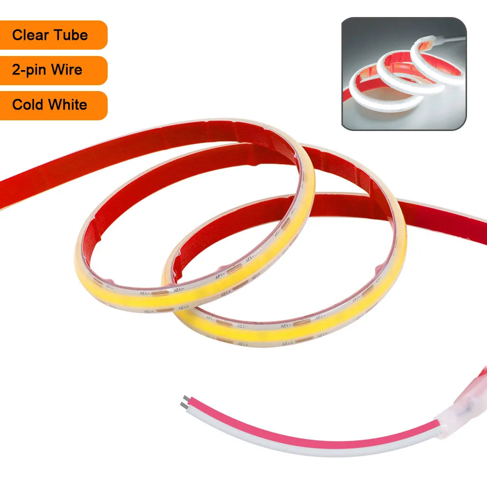 Flexible waterproof LED strip light, clear tube, red backing, coiled double strip with leads