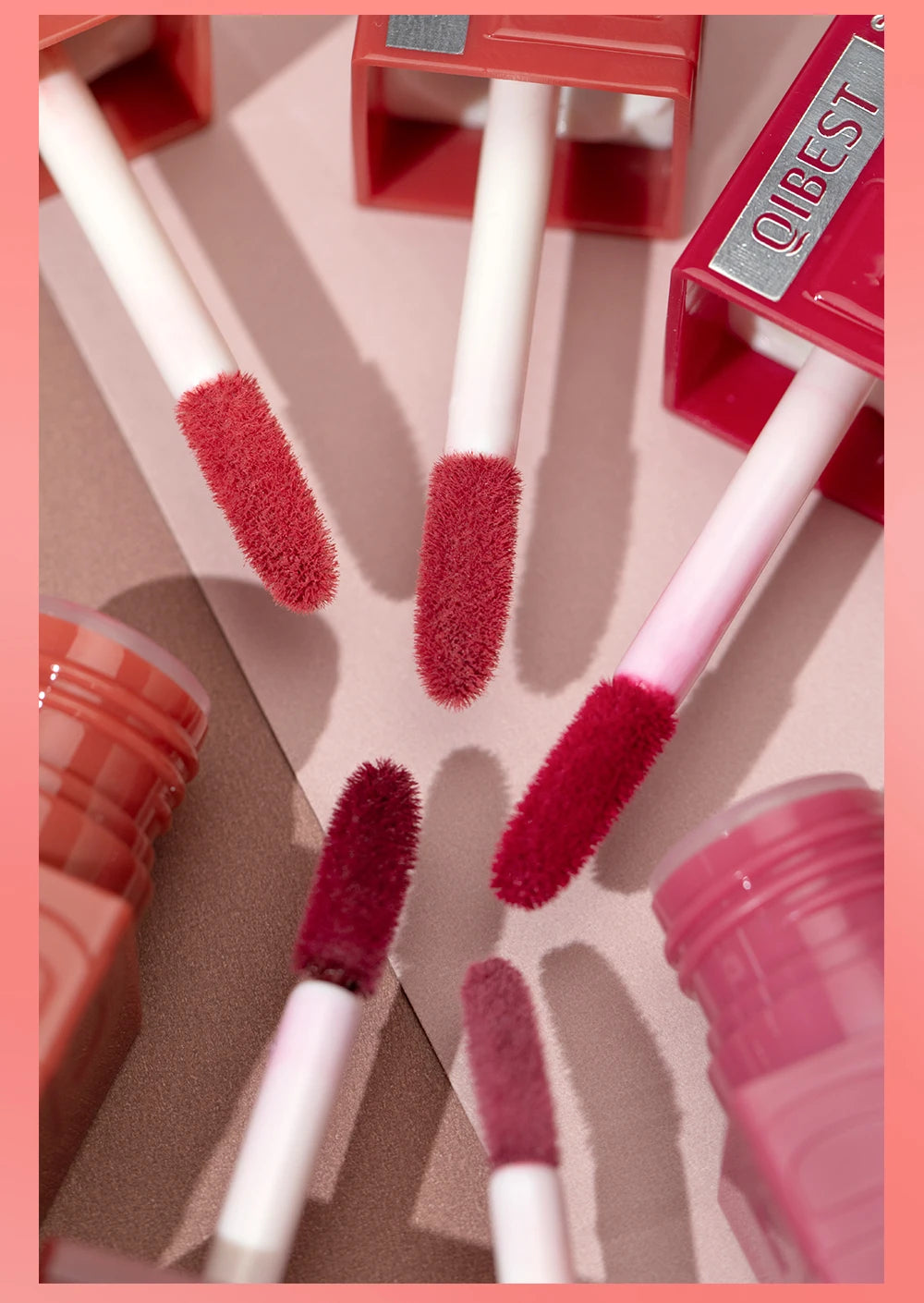 QIBEST 8-color watery lip gloss applicators, showing moisturizing mirror-finish liquid lipstick shades and wands.