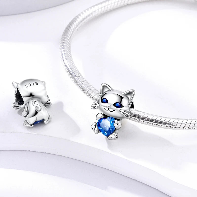 Sterling silver cat charm with blue crystal heart, fits European bracelets for pet lovers, perfect DIY jewelry gift.