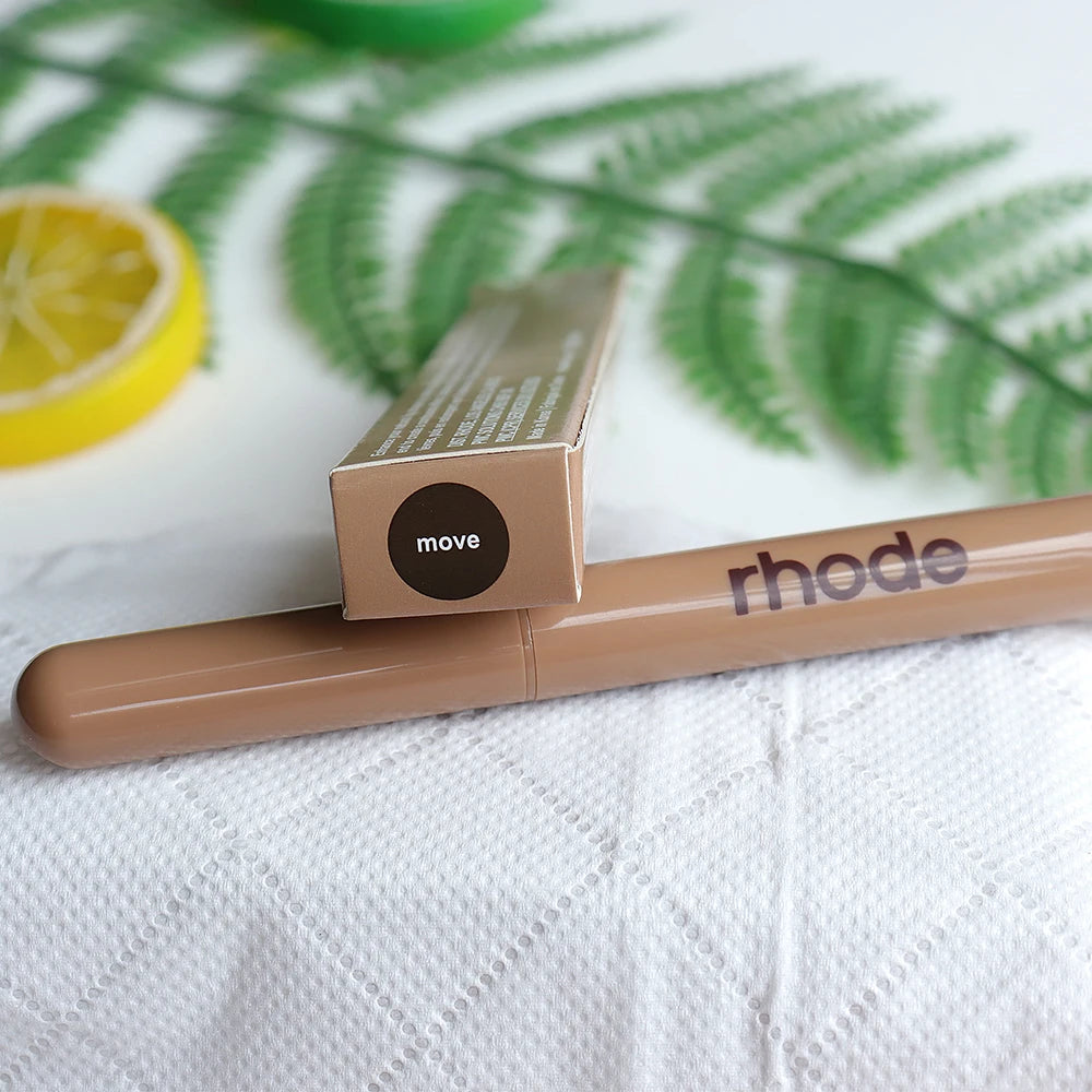 Rhode Peptide Lip Shape Pen in shade Move, a long-lasting brown lip liner pencil in its box, styled with greenery.