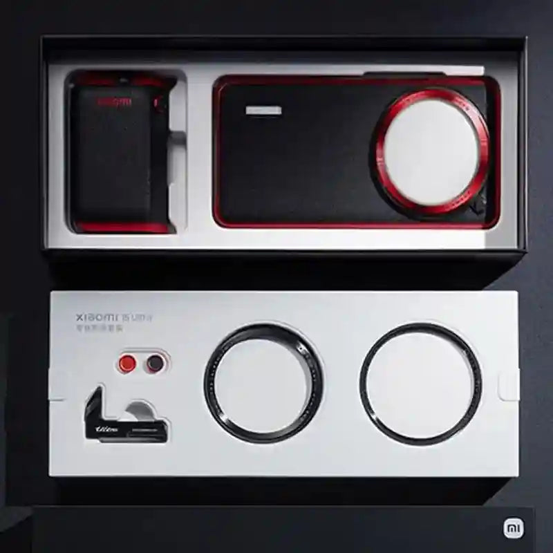 Smartphone photography kit with a leather-textured case, attachable lens, filter rings, and shutter buttons in a box.