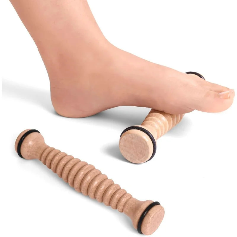Two wooden foot massage rollers with ridges, used under the foot to relieve pressure and provide relaxation.