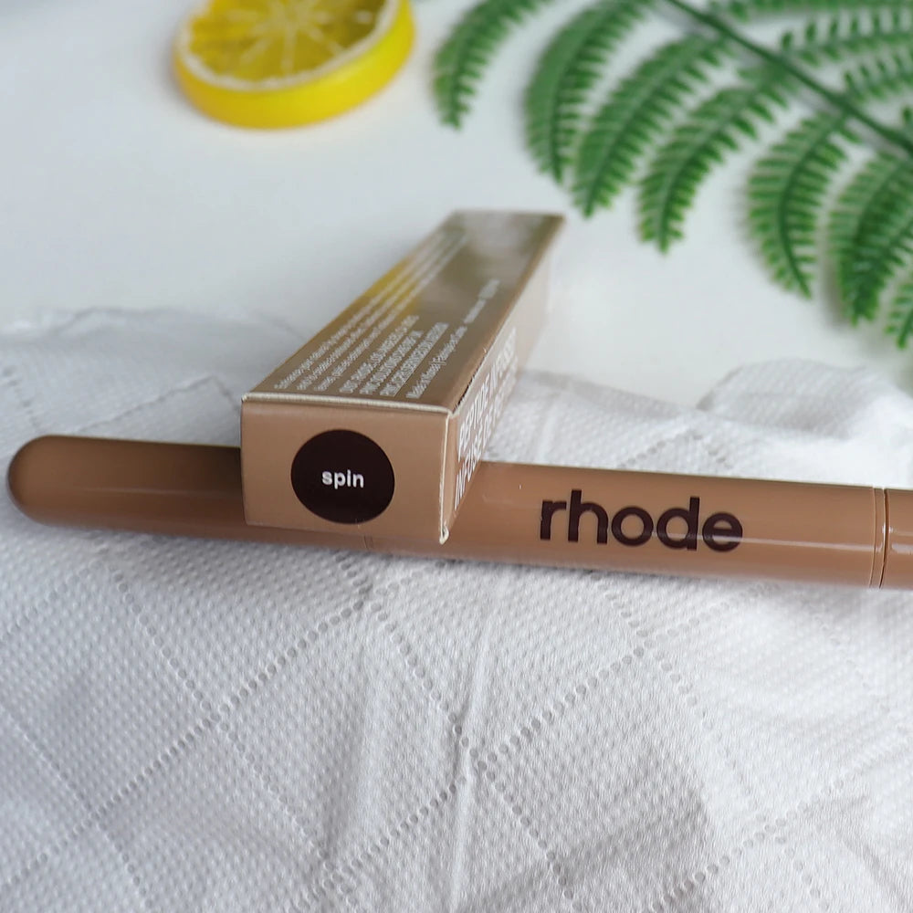 Rhode Skin Peptide Lip Shape Pen in Spin shade, a long-lasting brown lip liner pencil in beige box packaging.