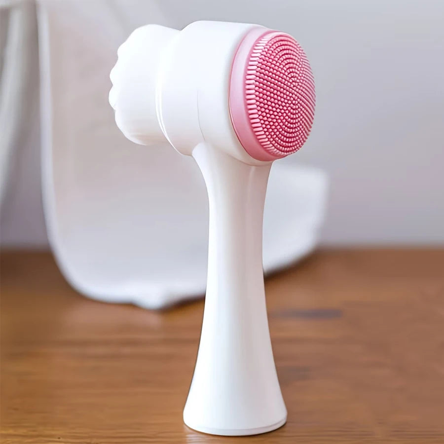 Double-sided facial cleansing brush with pink silicone exfoliator and soft bristles for manual daily pore care.