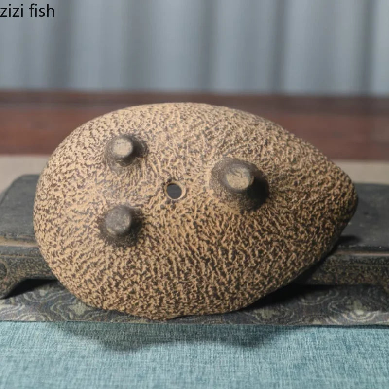 Fish-shaped ceramic planter, speckled sand finish with round drainage holes
