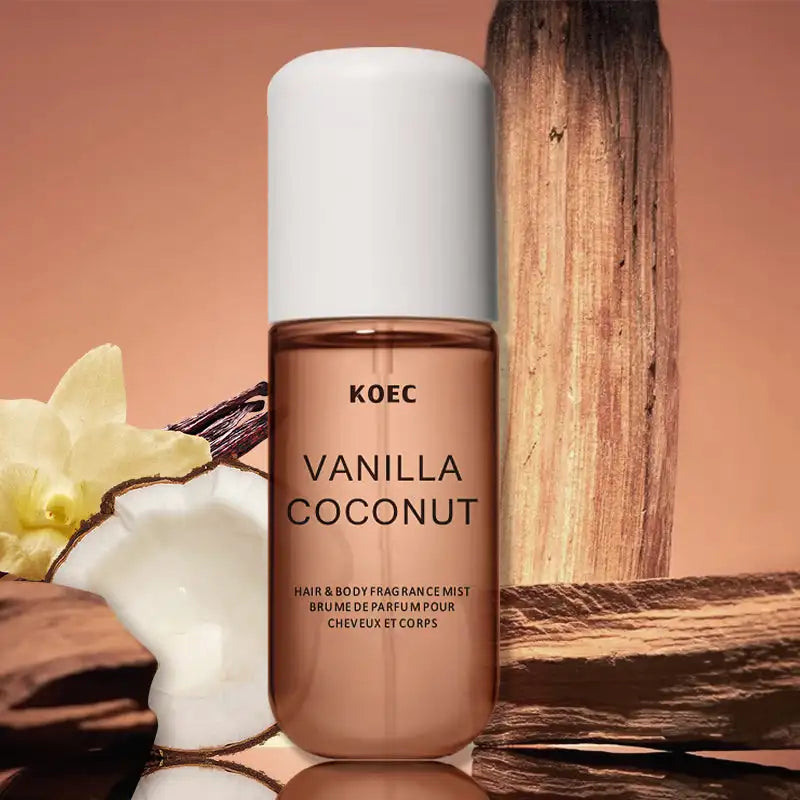 KOEC Vanilla & Coconut Hair & Body Fragrance Mist in a sleek cylindrical glass bottle with a white cap.