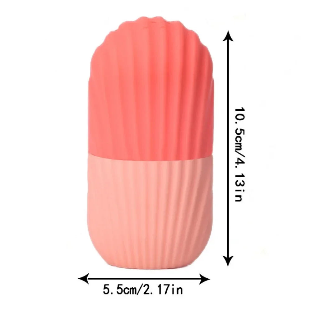 Two-tone coral silicone ice face roller with a ridged shell-like texture and dimension labels on a white background.