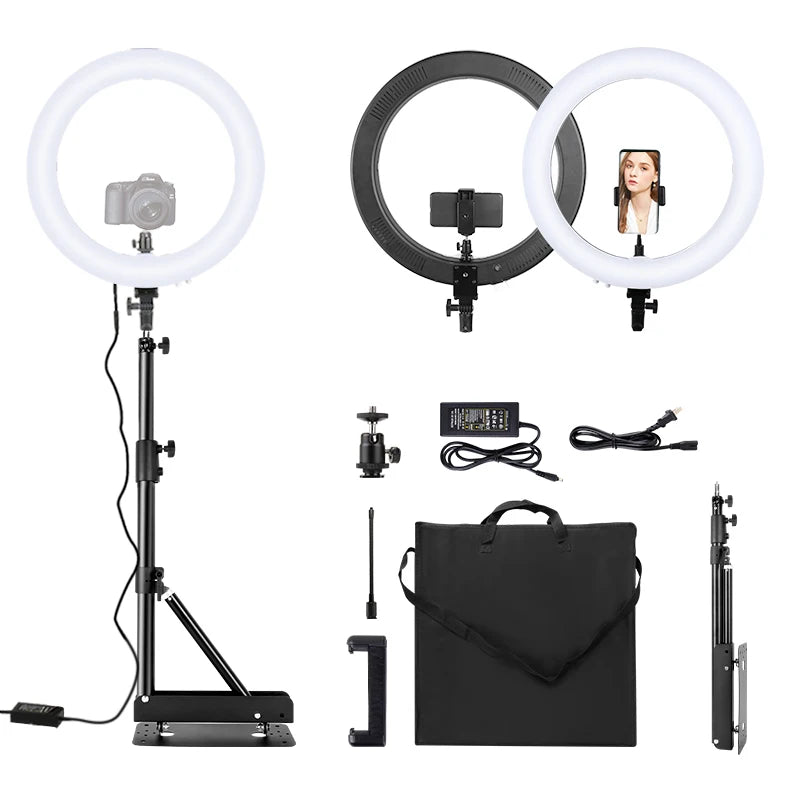Large circular LED ring light with black metal stand, phone and camera mounts, power adapter, and carrying case.