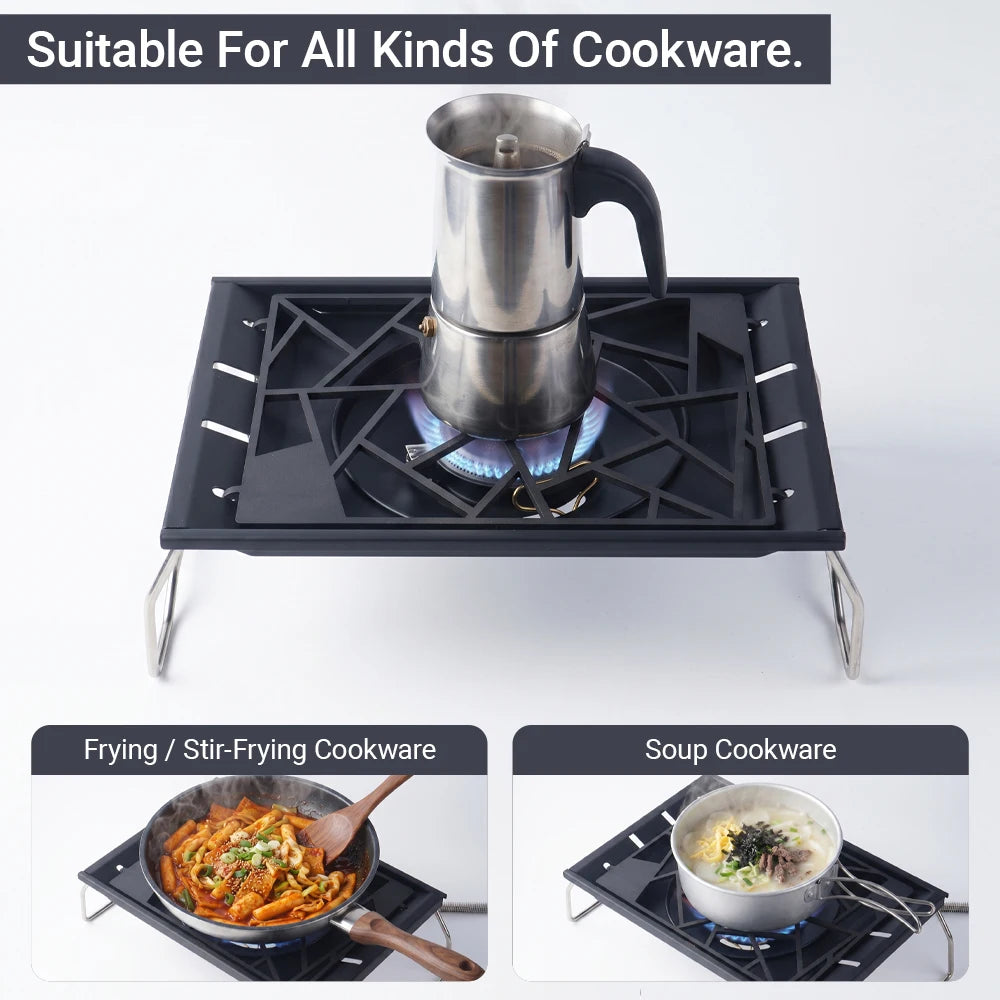 Tabletop camping stove with kettle and black grate, foldable steel legs