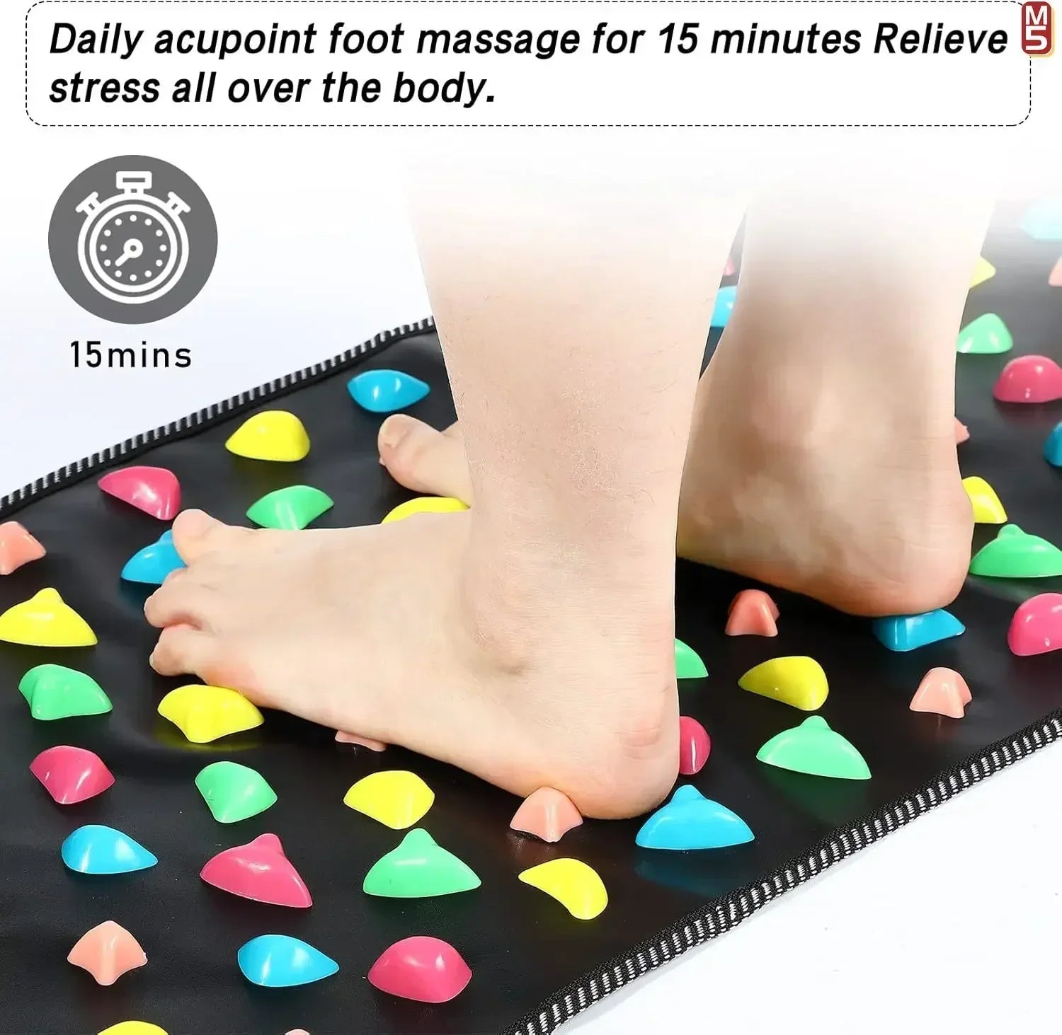 Person standing on a black acupressure foot reflexology massage mat with colorful stimulation stones for pain relief.
