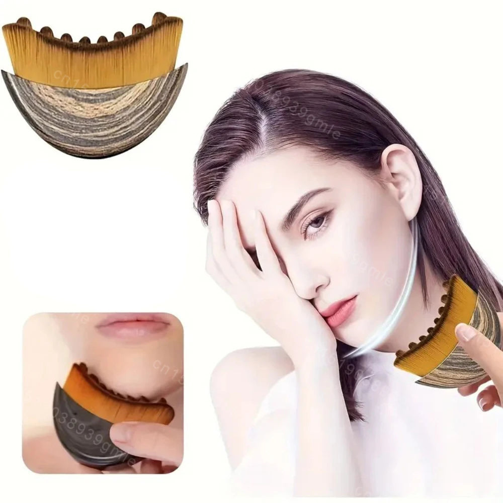 A curved lymphatic contour face brush with a wood-grain handle and soft, golden bristles used to sculpt the jawline.