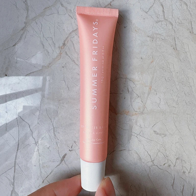Summer Fridays Lip Butter Balm in Vanilla Beige: A smooth, hydrating, soft pink squeeze tube for moisturizing lip care.