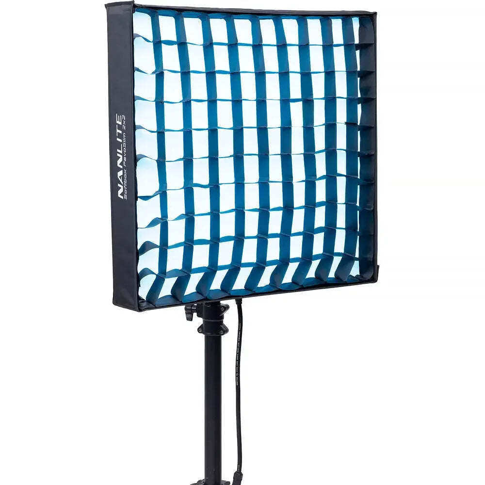 Square softbox with blue grid diffuser on a stand, used for light softening in photography and video production.