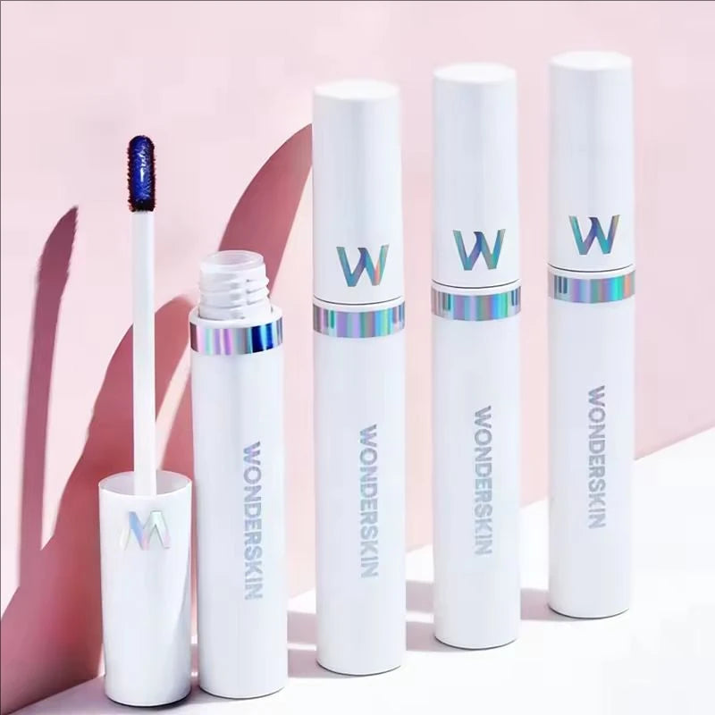 Wonderskin peel-off lip stain tubes with applicator, showing long-lasting waterproof pink tint formula on pink background.