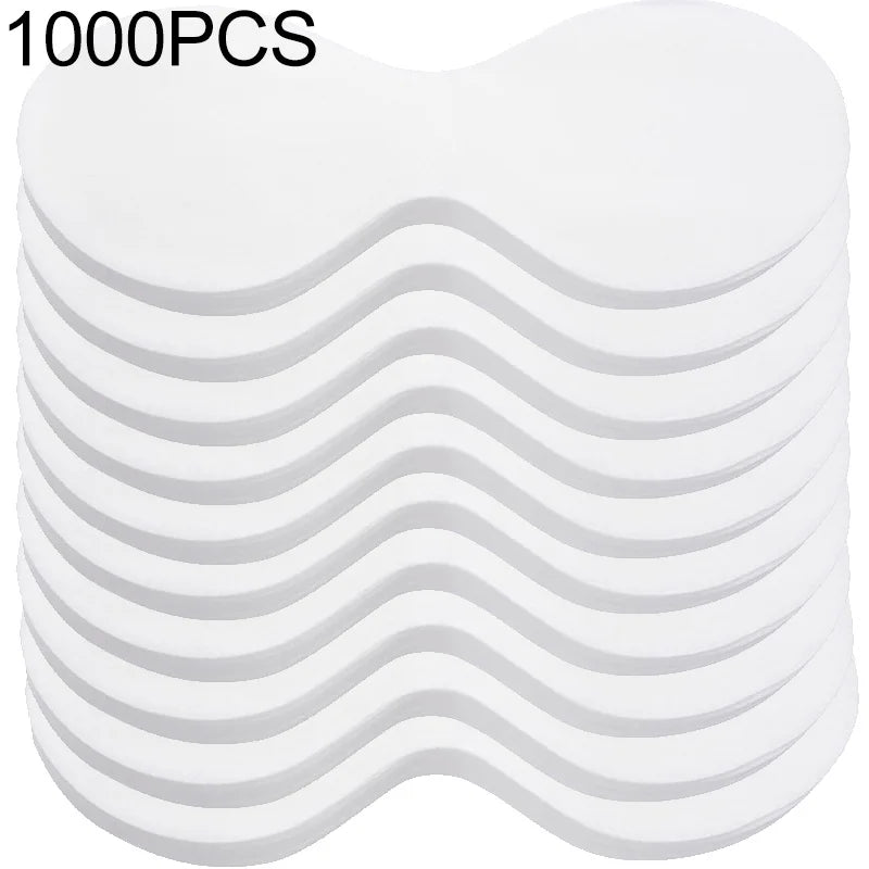 A stack of white, butterfly-shaped disposable cotton eye mask paper pads for DIY skincare.