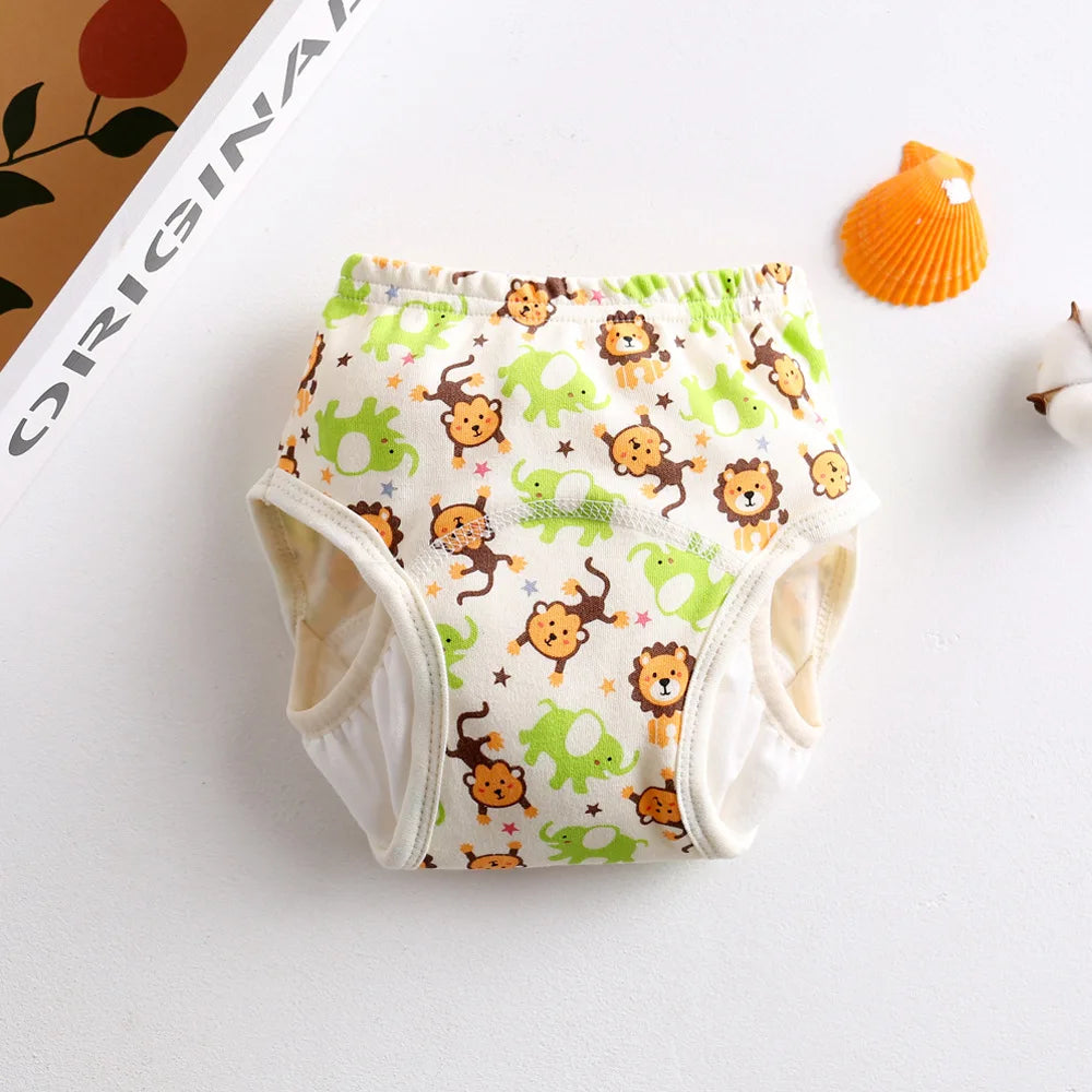 Baby training diaper with colorful animal print featuring lions, monkeys, and elephants on cream fabric.