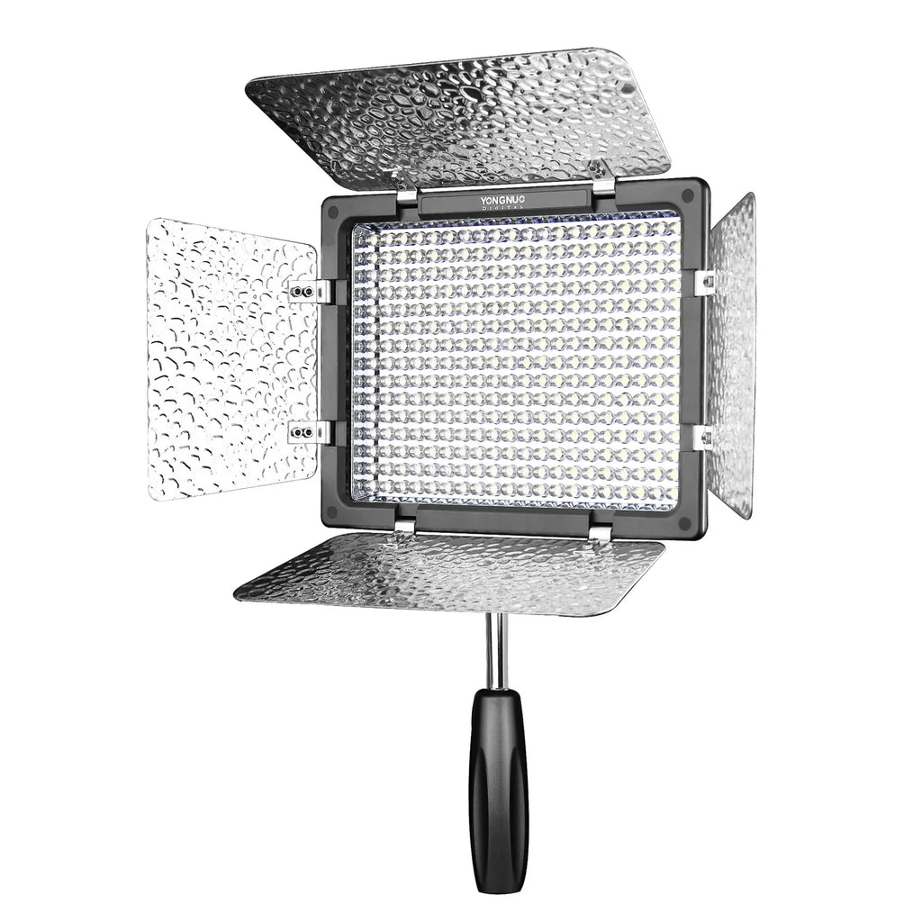 LED video light panel with four reflective silver barn doors and a black handheld grip for photography and videography.