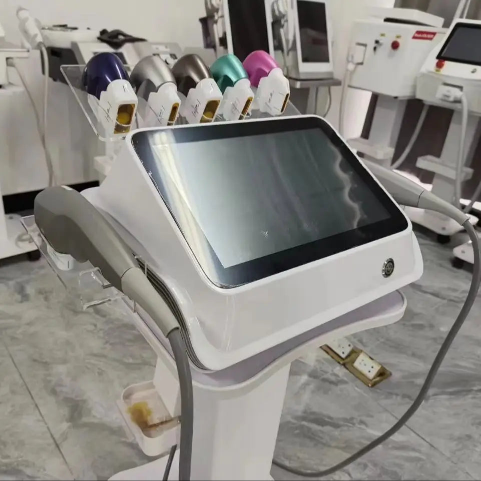 White 7D beauty SPA machine with a touchscreen, stand, and a row of colorful treatment cartridges on top.