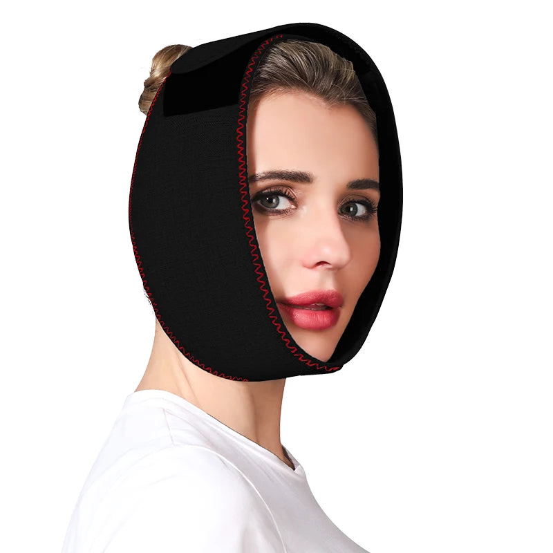 Woman wearing a black neoprene jaw heating pad with red stitched edges, secured around her face and head.