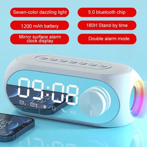 White alarm clock Bluetooth speaker with glowing digital display and volume-style dial