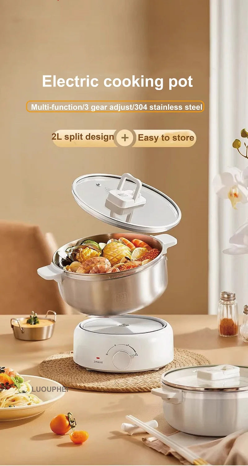 Electric cooking pot with glass lid and stainless bowl on a white base with control knob