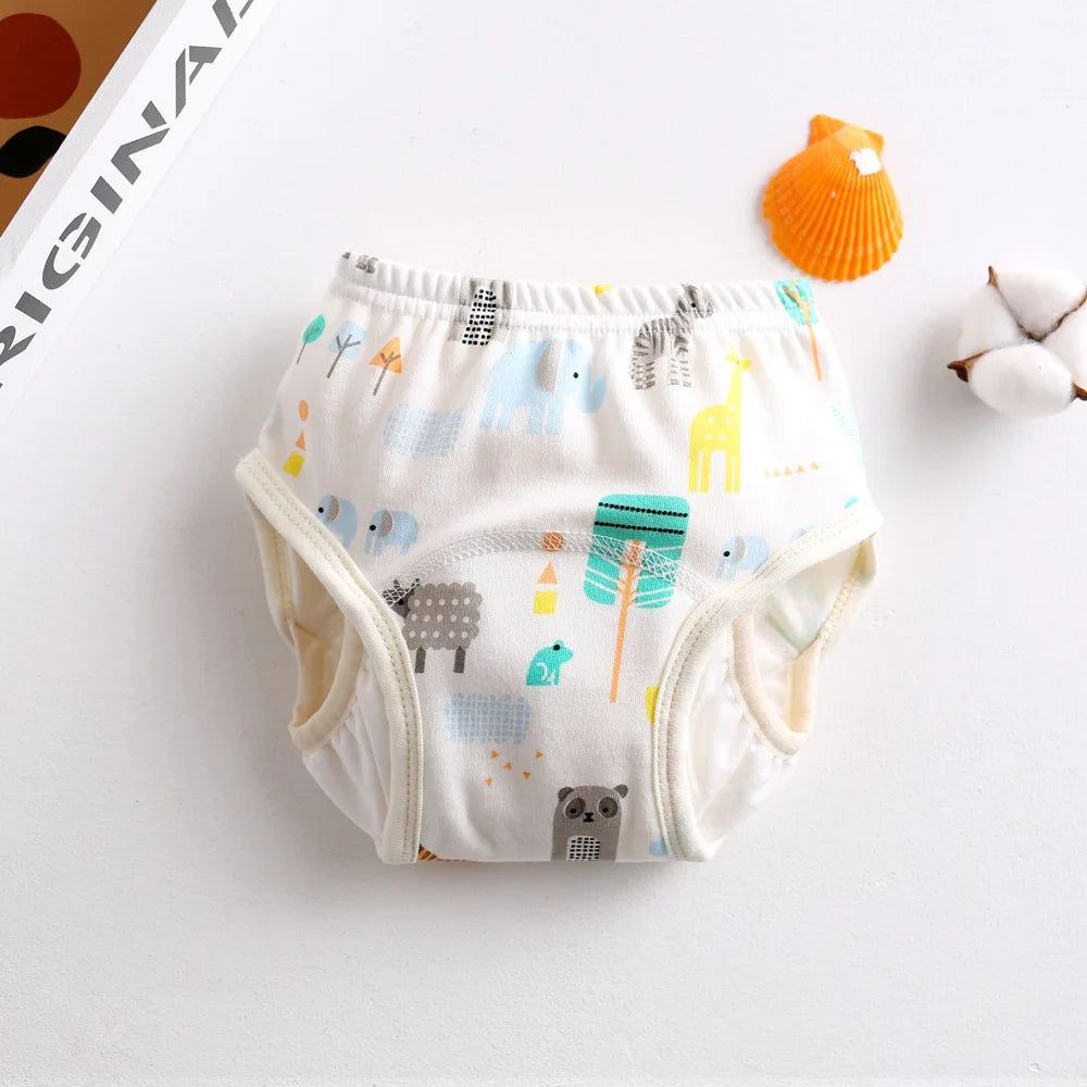 Reusable baby potty training diaper with cute zoo animal print pattern on white cotton fabric.