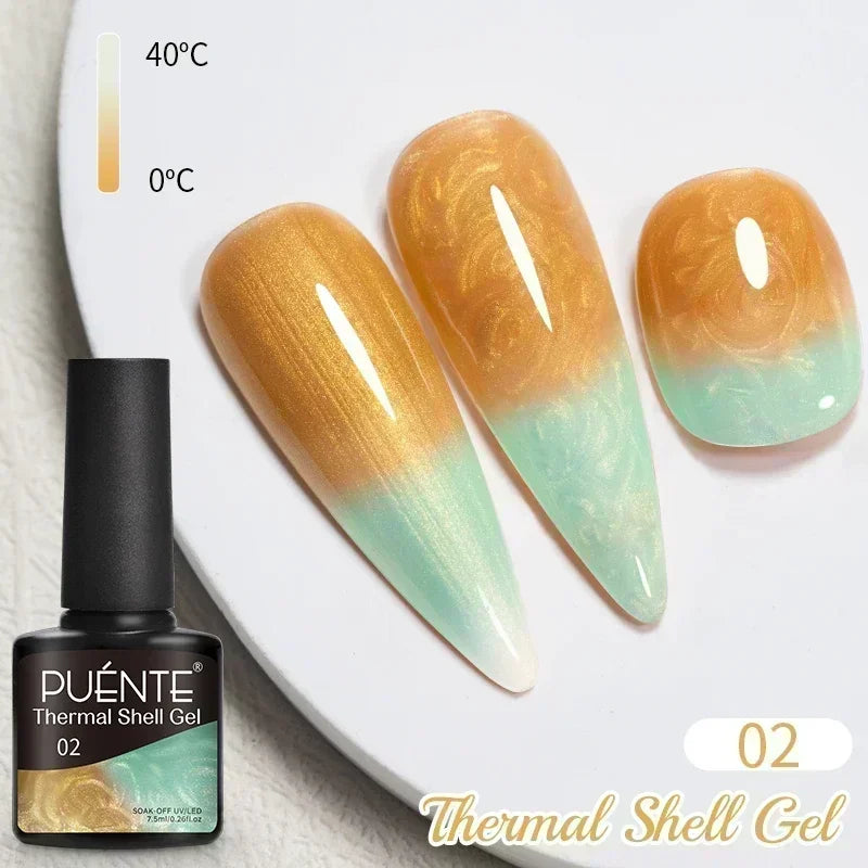 Thermal shell gel nail polish in a gold to mint green color-changing ombre finish on three display nail tips.