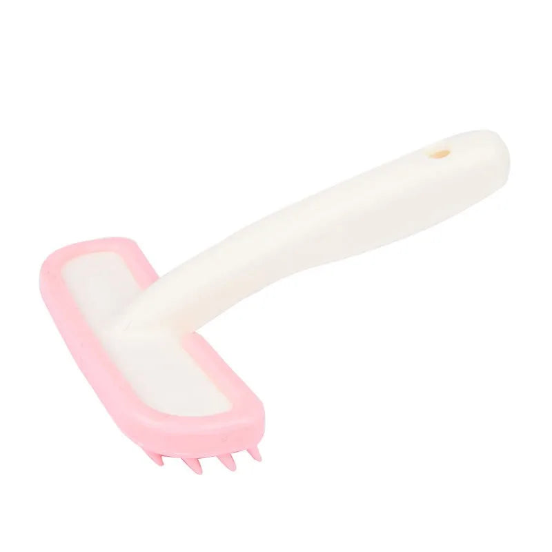 Pink silicone grooming comb for small pets like rabbits and guinea pigs to gently remove loose hair and clean fur.