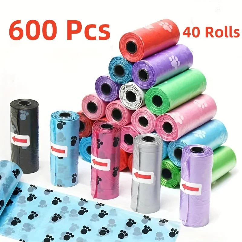 600 pcs leak-proof dog poop bags with colorful cartoon paw prints for easy, clean pet waste cleanup.