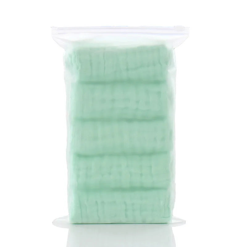 Pack of light green cotton baby care muslin washcloths in a clear zip bag.