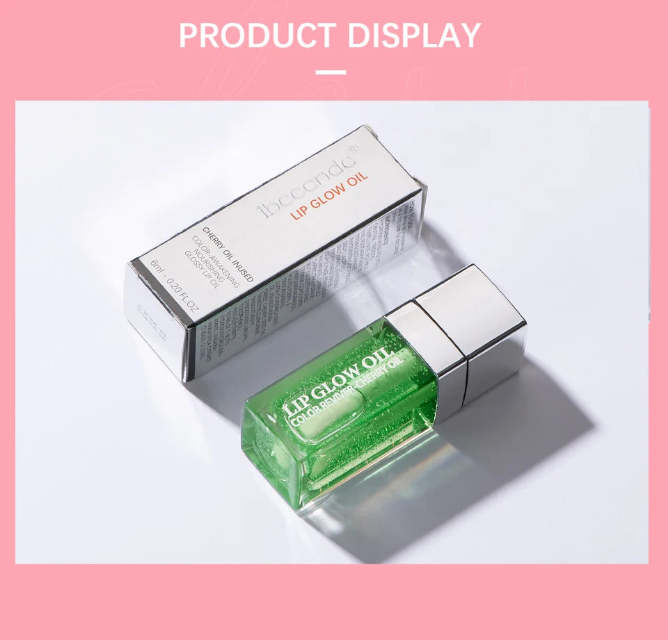 Green crystal jelly lip oil with cherry extract, moisturizing plumping lip gloss in a sleek square glass bottle.