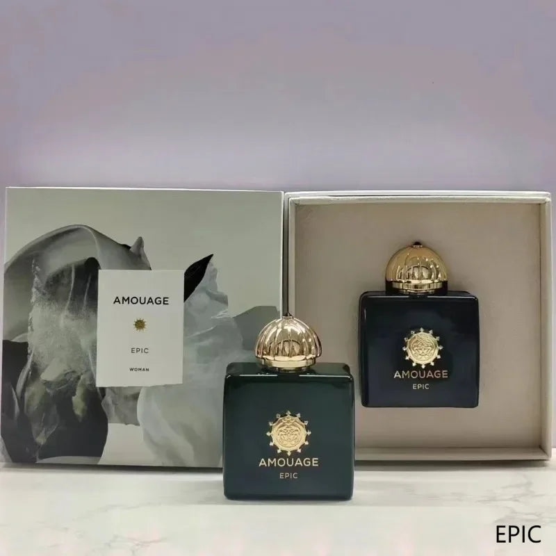 Amouage Epic Woman perfume set: dark green glass bottles with gold caps and ornate floral packaging box.