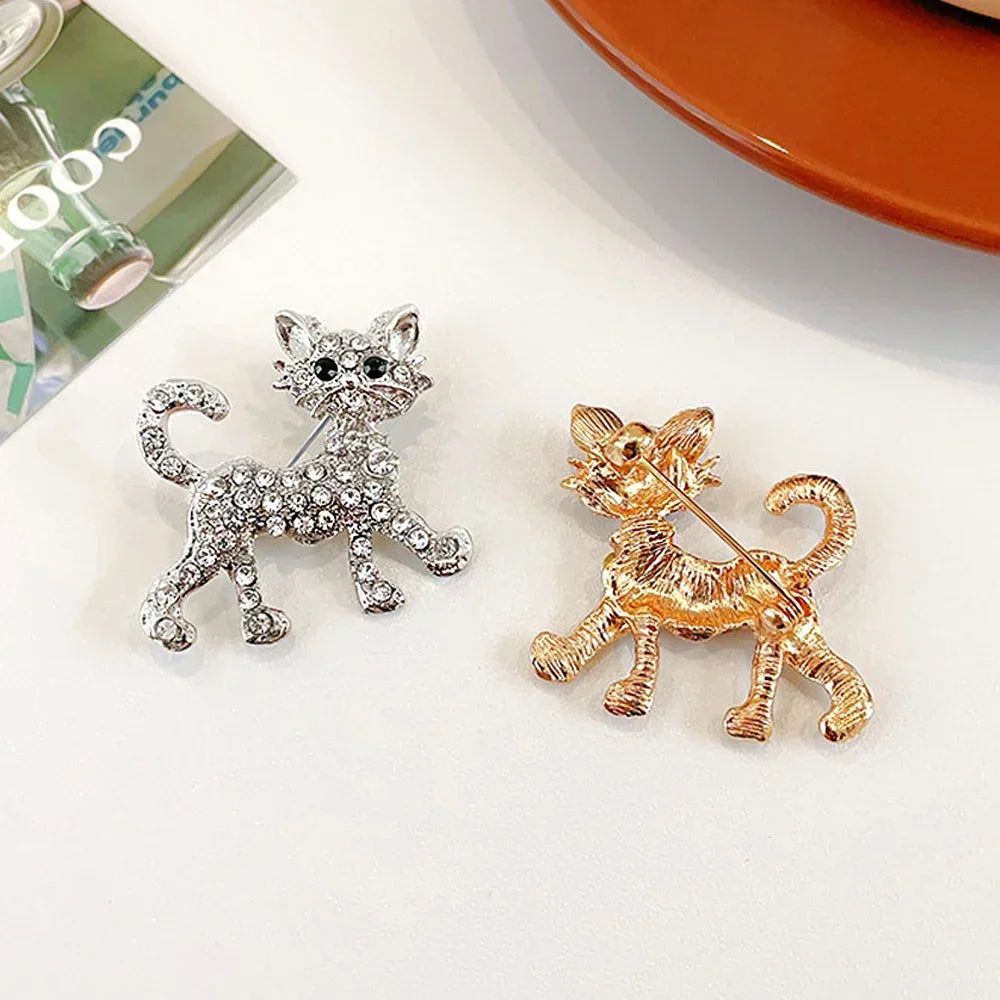 Sparkling crystal cat lapel pins in gold and silver, perfect cat lover jewelry gifts for sweaters, bags, or coats.