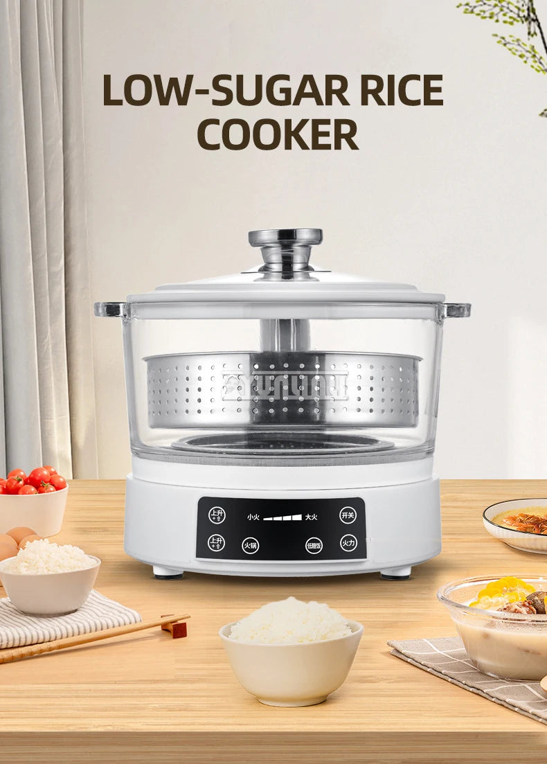 White electric rice cooker with clear lid and steaming basket on countertop, front 3/4 view.