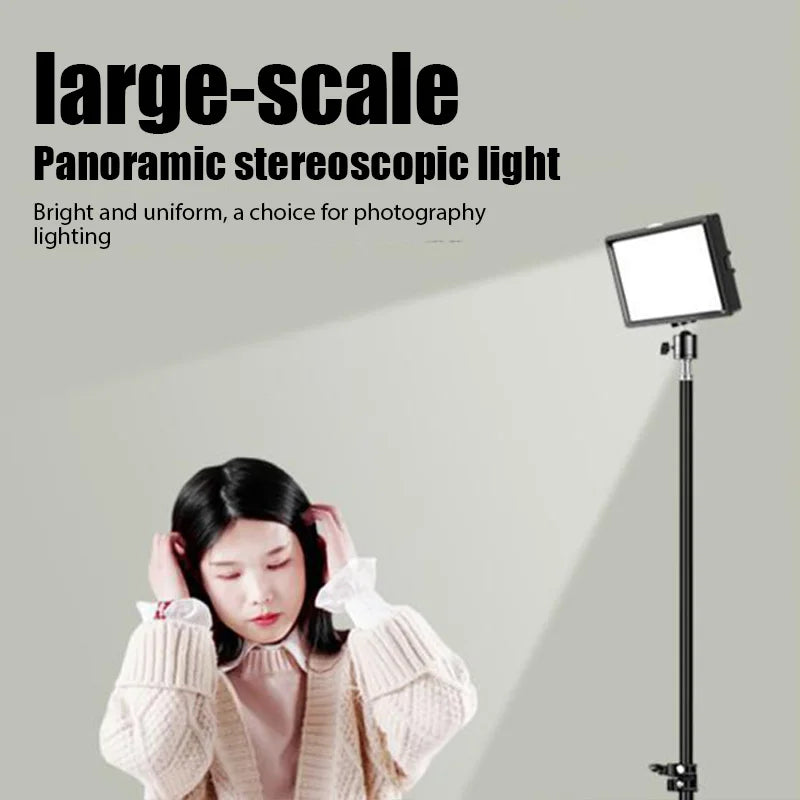 Rectangular LED photography light on a tall black tripod stand, illuminating a person in front.