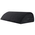 Black memory foam office footstool with mesh cover and handle for improved posture and leg support.