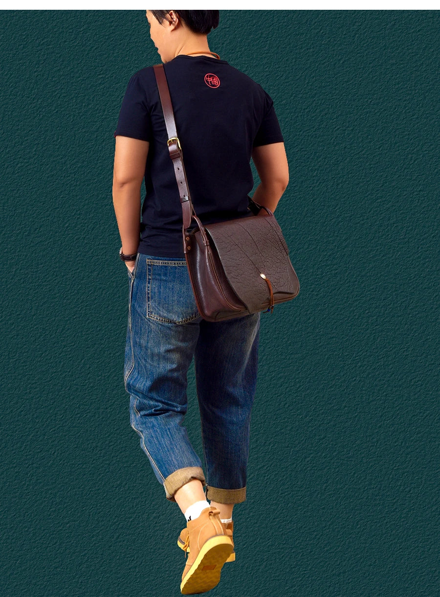 PNDME vintage dark brown cowhide messenger bag, handmade genuine leather shoulder bag for travel, designer style.
