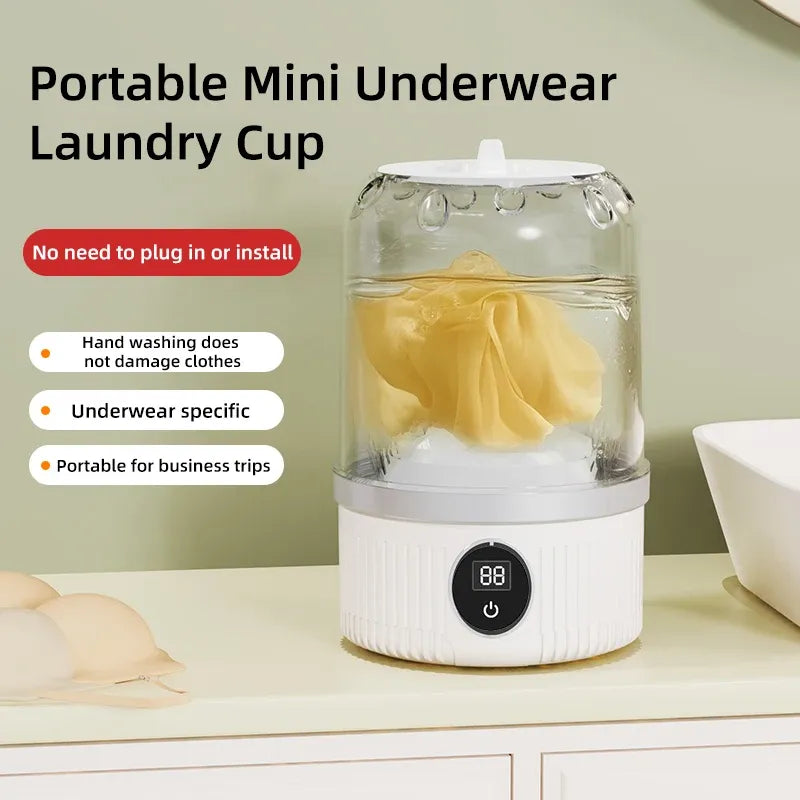 Portable mini underwear laundry cup washing gentle undergarments on a white countertop with digital display.
