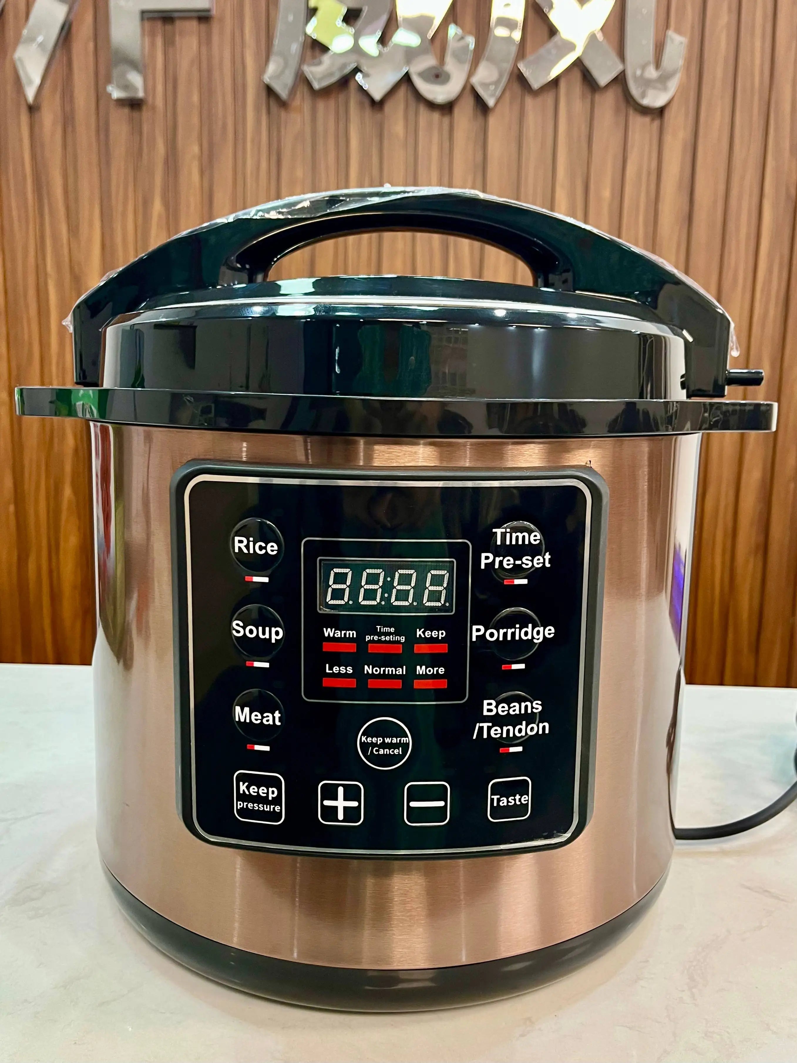Stainless electric pressure cooker with digital presets panel and Time Pre-set display