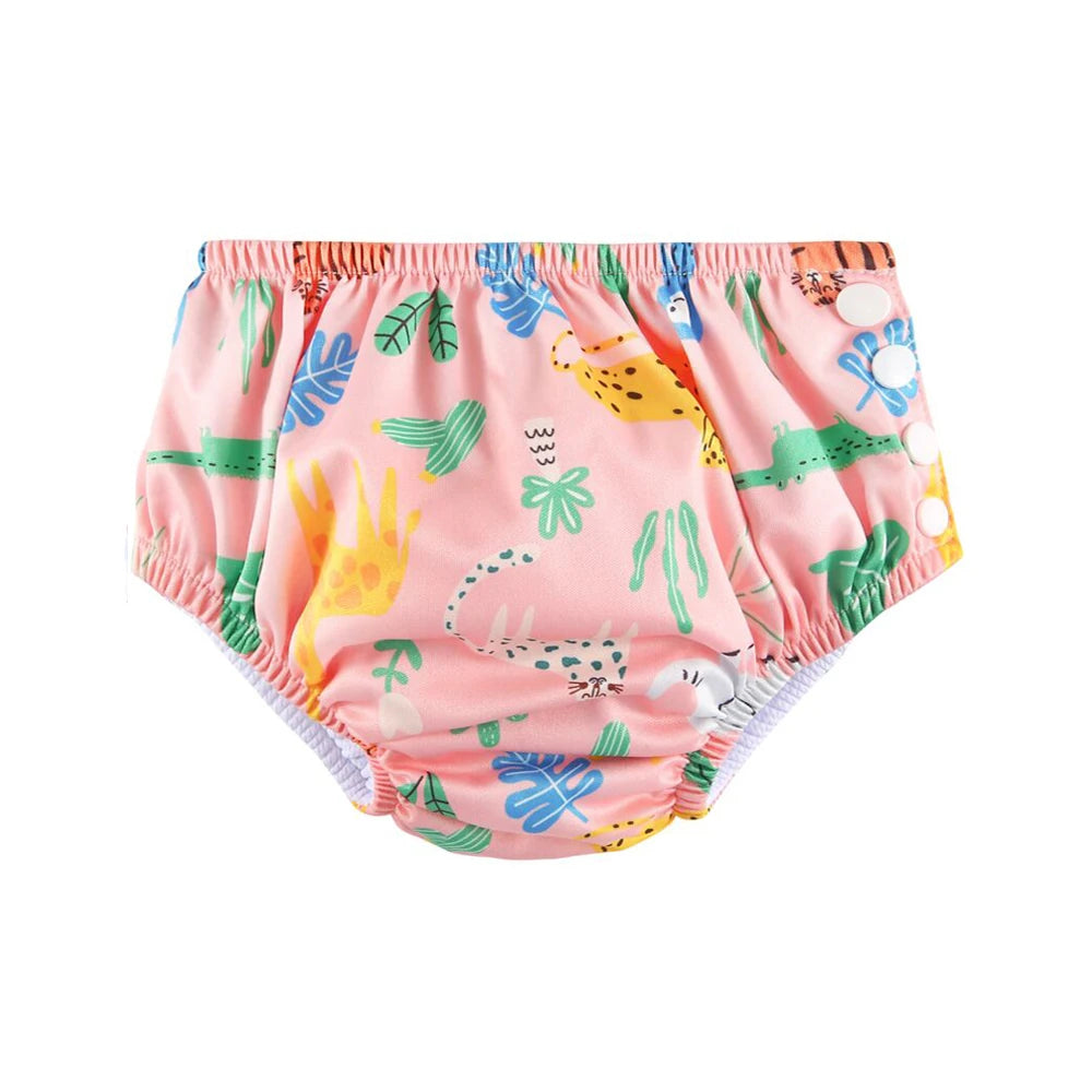 Reusable baby swim diaper with pink jungle animal print and side snap buttons for adjustable fit.