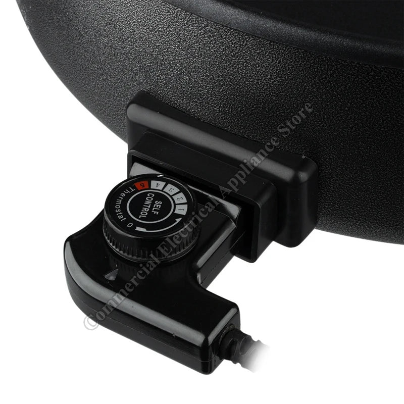 Electric hot pot thermostat control dial with heat/time icons on the black base.