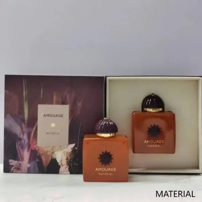 Amouage Material 100ml Eau de Parfum, set of brown rectangular glass bottles with dark lids in a luxury display box.