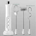 White handheld electric milk frother with 3 speed settings and 3 detachable stainless steel mixing heads on a stand.