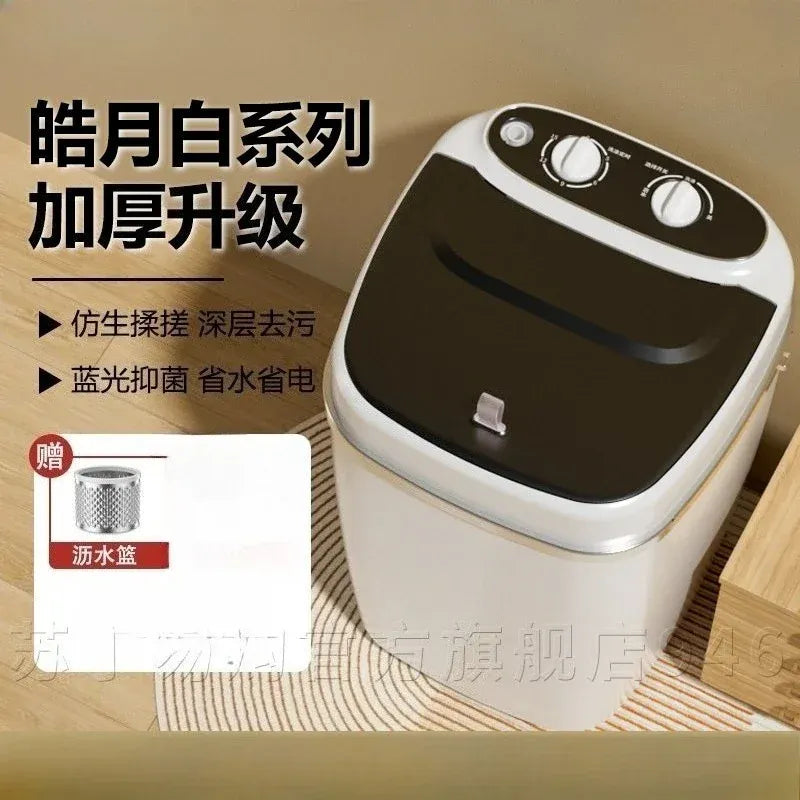 Portable washing machine in white and black with top dials and a removable drain basket.
