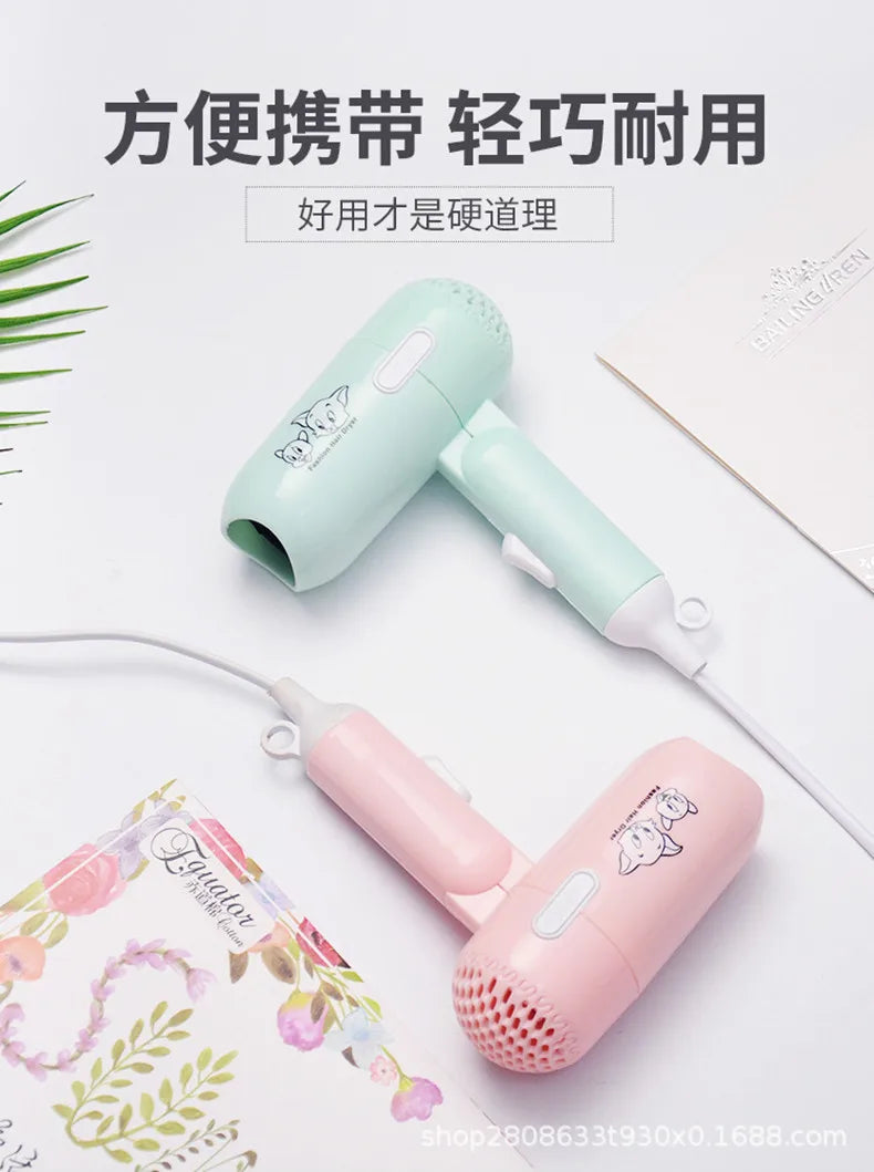 Foldable mini hair dryers in pastel green and pink, featuring high-power, quiet ionic drying for quick styling.