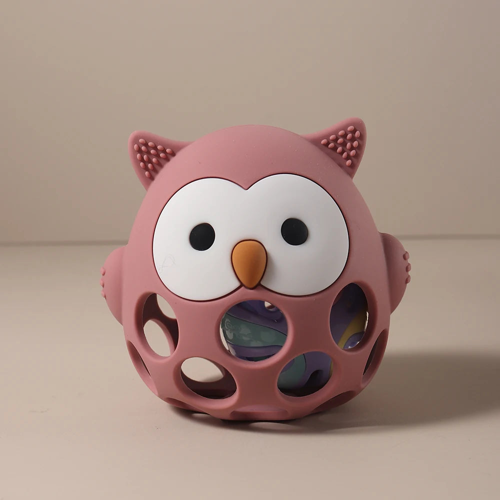 Pink owl silicone baby teething toy for soothing sore gums.