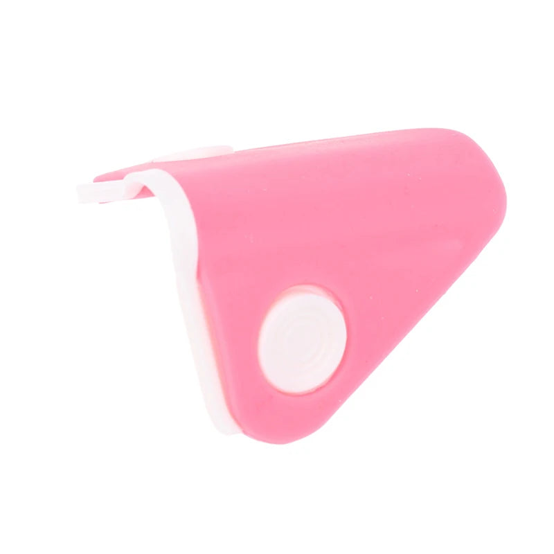 Pink silicone nose shaper lifting clip for nasal bridge straightening and facial beauty correction.