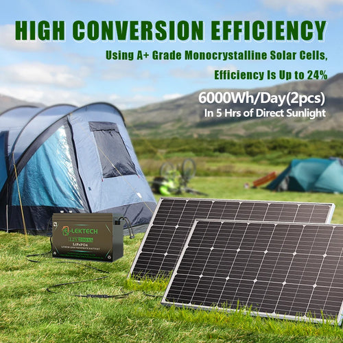 Two black monocrystalline solar panels and a Lektech lithium battery set up on grass near a tent at a campsite.
