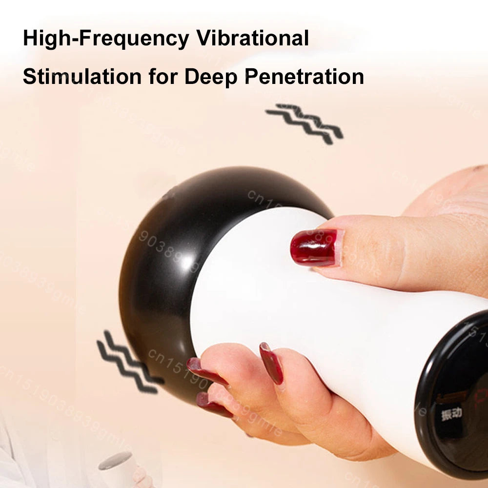 A hand holds a white, handheld electric Gua Sha massager with a smooth black massage head and digital display base.