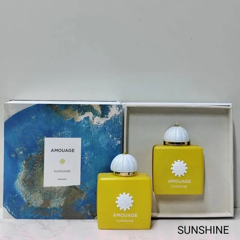 Amouage Sunshine Woman EDP: Luxury yellow square bottle, white domed cap, feminine floral fragrance in gift box.